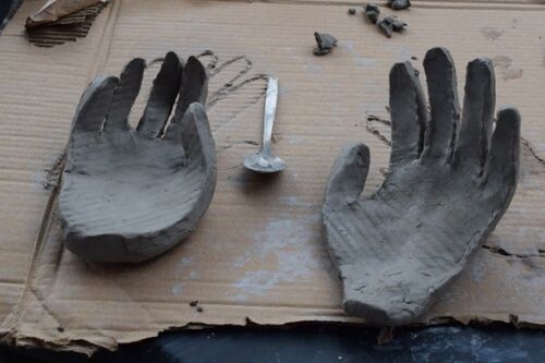 clay sculpture of pair of cupped hands